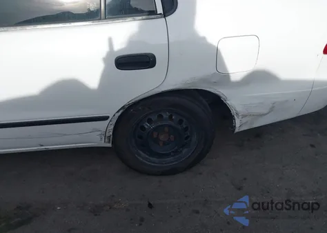 2002 Toyota Corolla Ce z USA, uszkodzony, nr VIN 1NXBR12E52Z566062